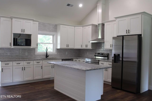 136 Log Ln, Jacksboro, TN 37757 - kitchen featuring appliances with stainless steel finishes, wall chimney exhaust hood, a sink, white cabinetry, and lofted ceiling