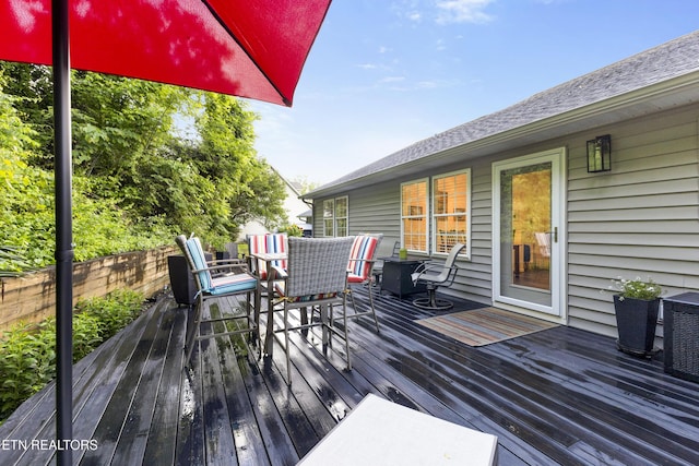 134 Jordan Dr, Caryville, TN 37714 - wooden deck featuring outdoor dining area and a fenced backyard