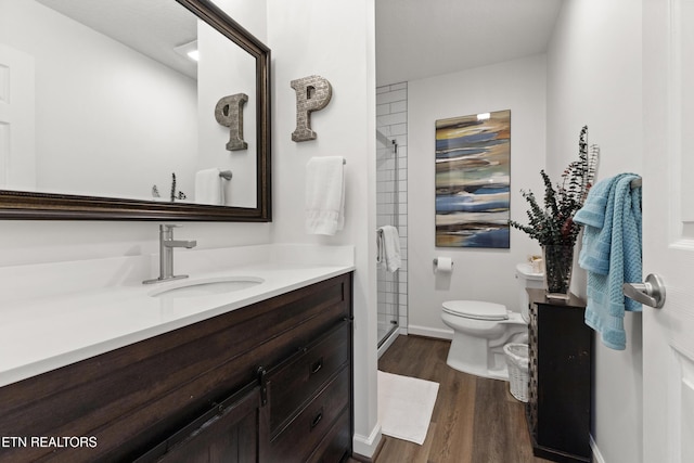 134 Jordan Dr, Caryville, TN 37714 - full bathroom featuring vanity, toilet, a shower stall, and wood finished floors