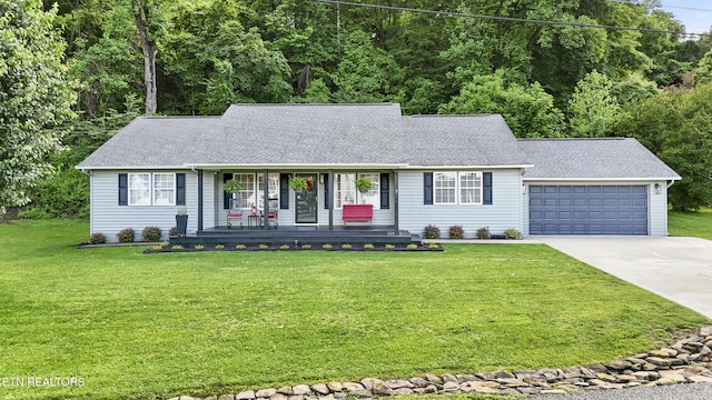 134 Jordan Dr, Caryville, TN 37714 - single story home featuring a porch, roof with shingles, concrete driveway, an attached garage, and a front lawn