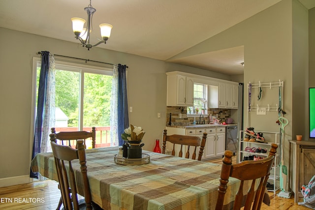 634 Robs Rd, Grimsley, TN 38565 - dining space with a chandelier, lofted ceiling, light wood-style floors, and baseboards