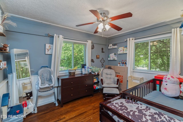 101 Temple Rd, Oak Ridge, TN 37830 - bedroom with hardwood / wood-style floors, a textured ceiling, crown molding, ceiling fan, and a wainscoted wall