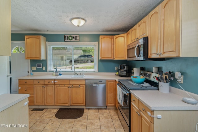 101 Temple Rd, Oak Ridge, TN 37830 - kitchen featuring appliances with stainless steel finishes, a sink, a textured ceiling, light countertops, and ornamental molding