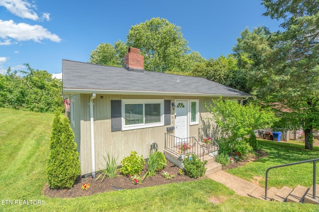 101 Temple Rd, Oak Ridge, TN 37830 - bungalow-style home featuring a chimney, a front lawn, and a shingled roof