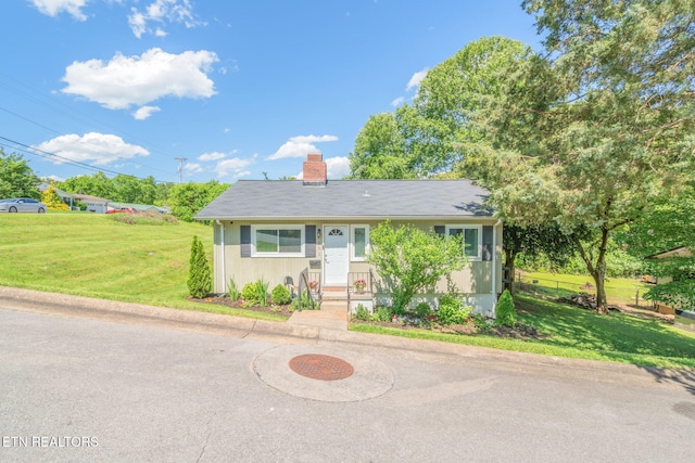 101 Temple Rd, Oak Ridge, TN 37830 - view of front of home featuring entry steps, a front lawn, and a chimney