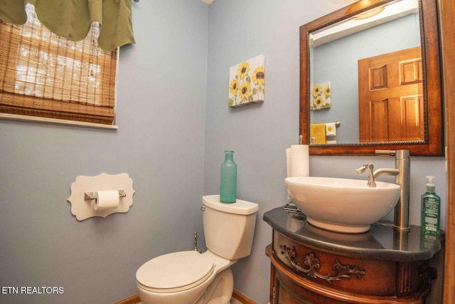 7745 Keswick Rd, Powell, TN 37849 - half bathroom featuring baseboards, toilet, and vanity