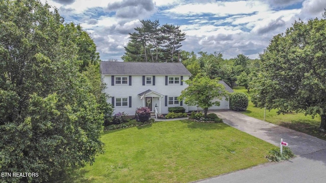 7745 Keswick Rd, Powell, TN 37849 - colonial-style house featuring concrete driveway and a front lawn
