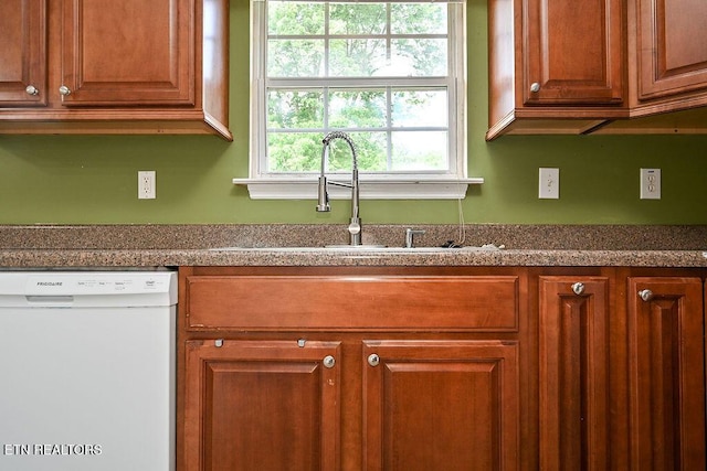 169 Claire St, Benton, TN 37307 - kitchen featuring white dishwasher, a sink, and brown cabinets