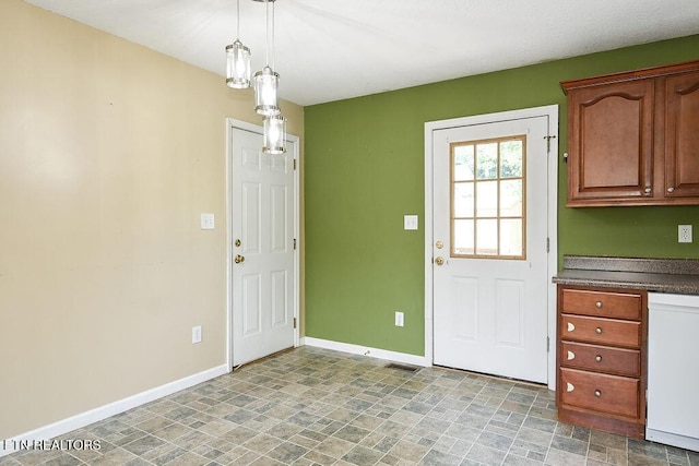 169 Claire St, Benton, TN 37307 - kitchen with dishwasher, stone finish floors, baseboards, and dark countertops