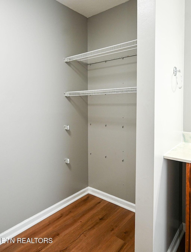 169 Claire St, Benton, TN 37307 - washroom featuring wood finished floors and baseboards
