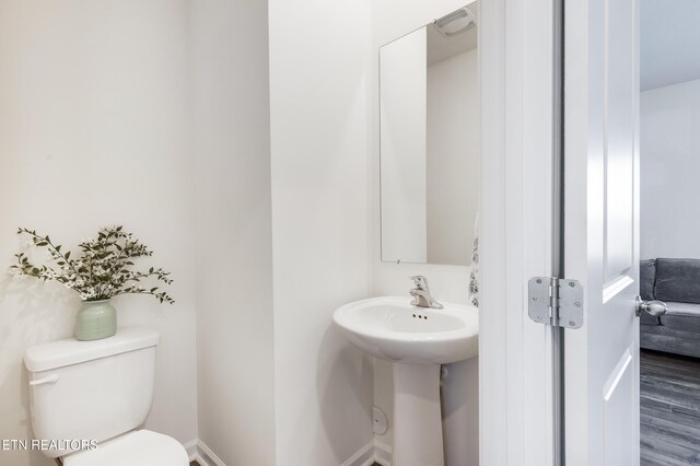 1024 Curly Top Ln, Knoxville, TN 37932 - bathroom featuring toilet, wood finished floors, and baseboards