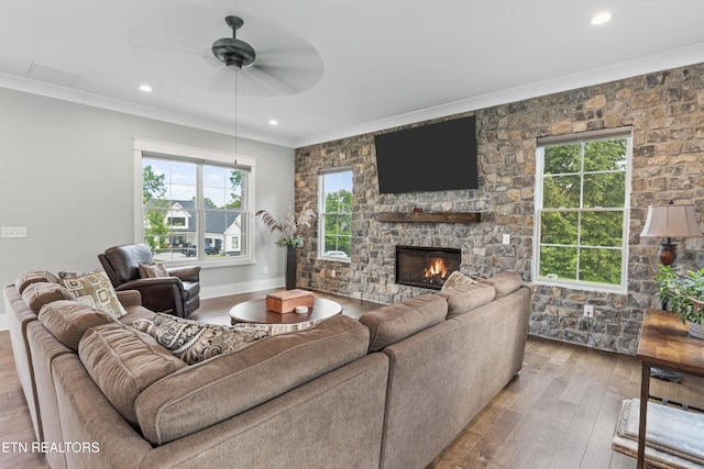 209 Fence Post Ln, Knoxville, TN 37934 - living room featuring crown molding, a ceiling fan, wood finished floors, a fireplace, and recessed lighting