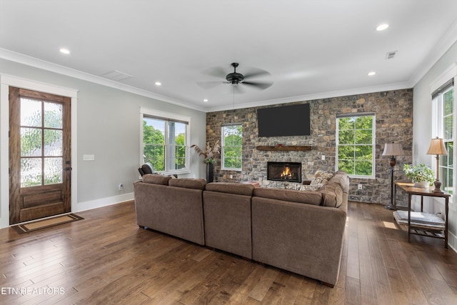209 Fence Post Ln, Knoxville, TN 37934 - living room with a ceiling fan, dark wood finished floors, a stone fireplace, crown molding, and recessed lighting