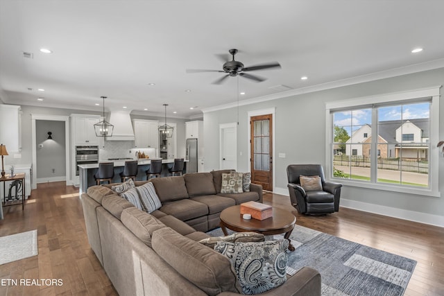 209 Fence Post Ln, Knoxville, TN 37934 - living room featuring recessed lighting, dark wood-type flooring, a ceiling fan, baseboards, and ornamental molding