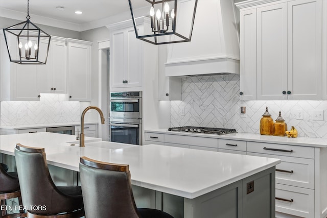 209 Fence Post Ln, Knoxville, TN 37934 - kitchen with a chandelier, appliances with stainless steel finishes, custom range hood, light countertops, and recessed lighting
