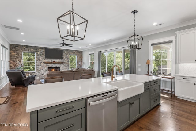 209 Fence Post Ln, Knoxville, TN 37934 - kitchen featuring dishwasher, a chandelier, gray cabinetry, a fireplace, and ornamental molding