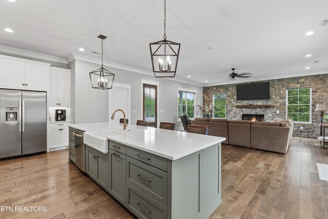 209 Fence Post Ln, Knoxville, TN 37934 - kitchen featuring appliances with stainless steel finishes, a sink, gray cabinets, white cabinets, and a ceiling fan