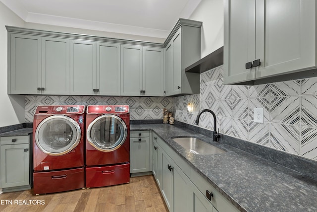 209 Fence Post Ln, Knoxville, TN 37934 - washroom with cabinet space, separate washer and dryer, and light wood-type flooring
