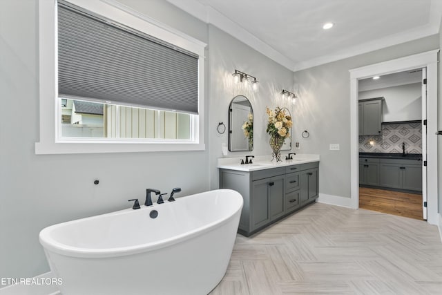 209 Fence Post Ln, Knoxville, TN 37934 - bathroom with a freestanding bath, double vanity, tasteful backsplash, recessed lighting, and baseboards