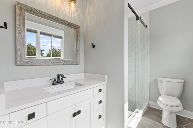 209 Fence Post Ln, Knoxville, TN 37934 - full bathroom with toilet, a stall shower, vanity, tile patterned floors, and baseboards