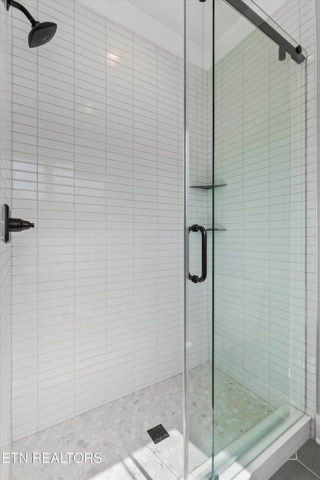 209 Fence Post Ln, Knoxville, TN 37934 - bathroom featuring a stall shower and tile patterned floors