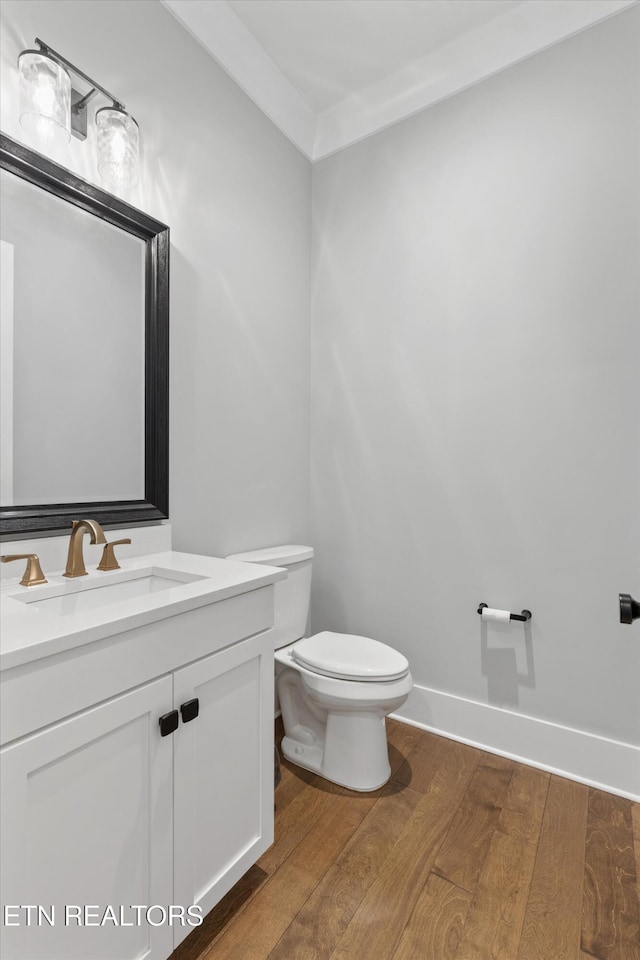 209 Fence Post Ln, Knoxville, TN 37934 - half bathroom featuring wood finished floors, toilet, vanity, and baseboards