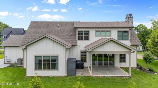 209 Fence Post Ln, Knoxville, TN 37934 - rear view of house featuring a shingled roof, central air condition unit, a patio area, and a chimney
