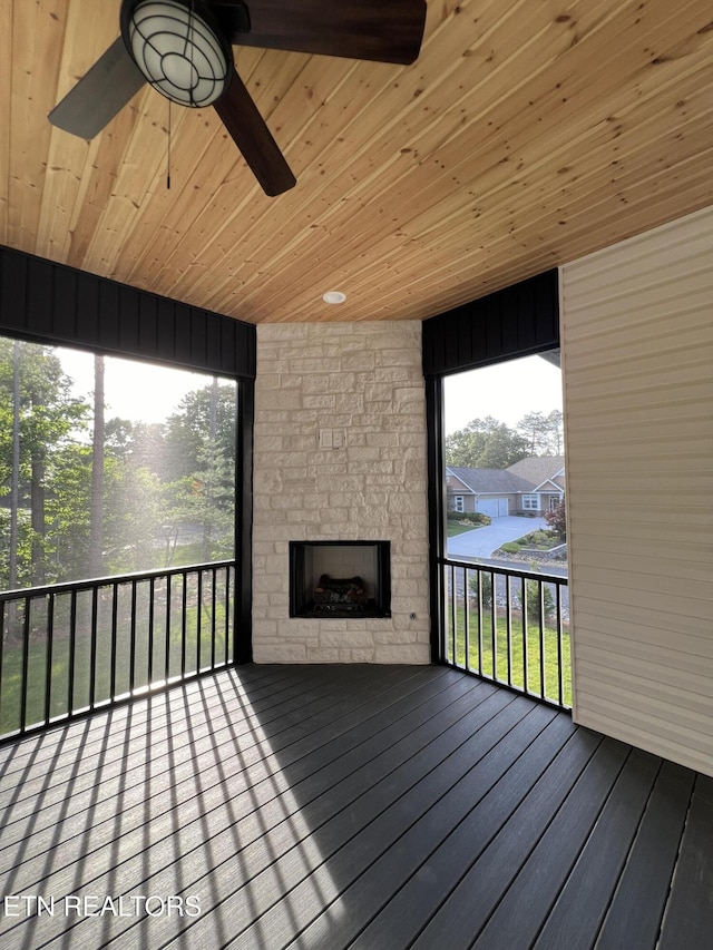 wooden deck with a fireplace
