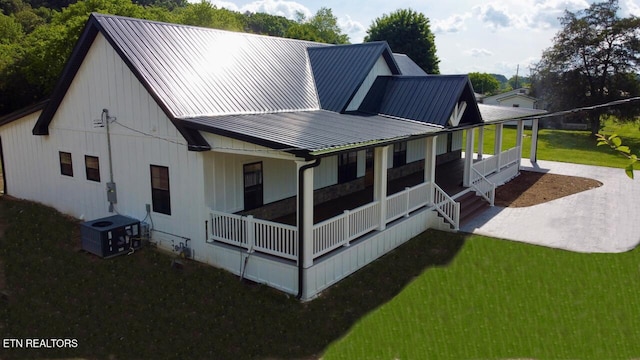 151 Clear Creek Rd, Newport, TN 37821 - rear view of property with covered porch, central AC, a lawn, and metal roof