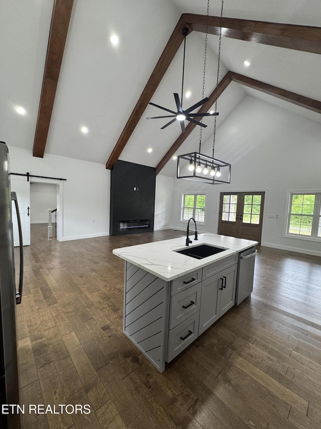 151 Clear Creek Rd, Newport, TN 37821 - kitchen featuring open floor plan, a sink, dishwasher, beam ceiling, and baseboards