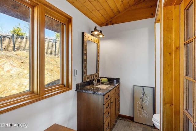 bathroom featuring lofted ceiling, toilet, wood ceiling, and vanity