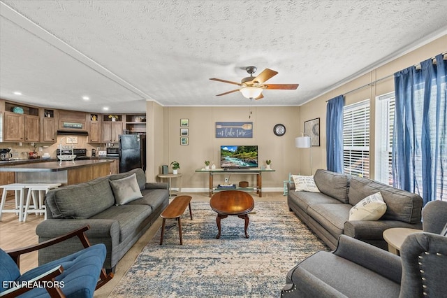 2061 Bolestown Loop, Alpine, TN 38543 - living room featuring a ceiling fan, recessed lighting, crown molding, a textured ceiling, and baseboards