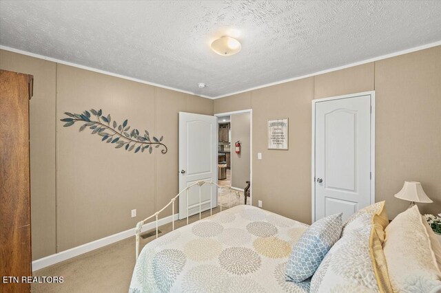 2061 Bolestown Loop, Alpine, TN 38543 - bedroom with carpet floors, a textured ceiling, crown molding, and baseboards