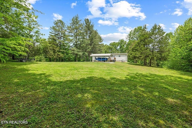 2061 Bolestown Loop, Alpine, TN 38543 - view of green lawn with a carport