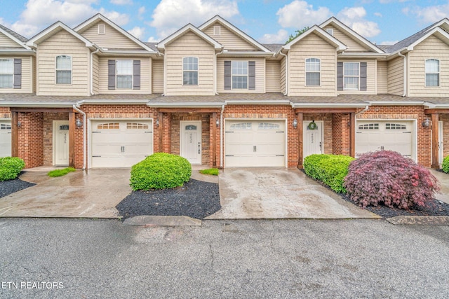 4834 Fountain View Way, Knoxville, TN 37918 - view of property with a garage, brick siding, driveway, and a shingled roof