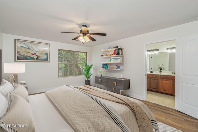 4834 Fountain View Way, Knoxville, TN 37918 - bedroom featuring light wood-type flooring, a sink, connected bathroom, baseboards, and ceiling fan