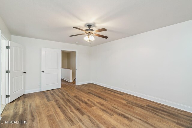 4834 Fountain View Way, Knoxville, TN 37918 - unfurnished bedroom featuring baseboards, wood finished floors, and ceiling fan