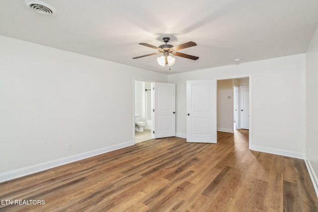 4834 Fountain View Way, Knoxville, TN 37918 - unfurnished bedroom with baseboards, wood finished floors, connected bathroom, and a ceiling fan