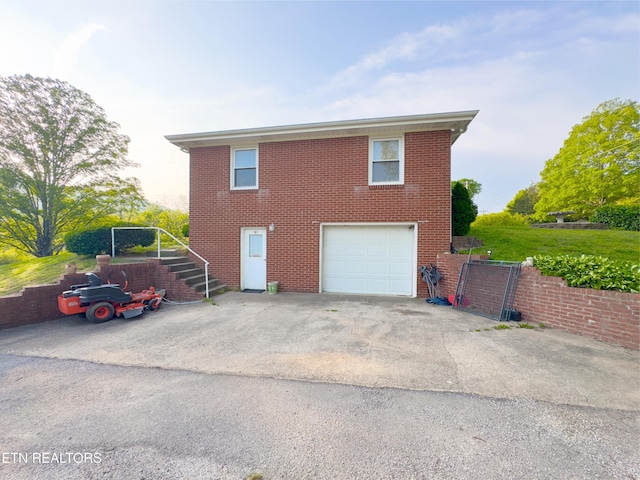 161 Cedar Ln, Rocky Top, TN 37769 - exterior space with stairway, asphalt driveway, a garage, and brick siding