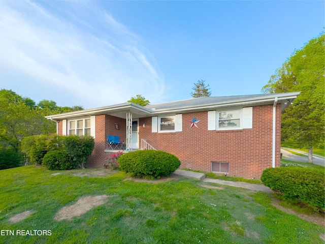 161 Cedar Ln, Rocky Top, TN 37769 - view of front of home featuring a front yard and brick siding