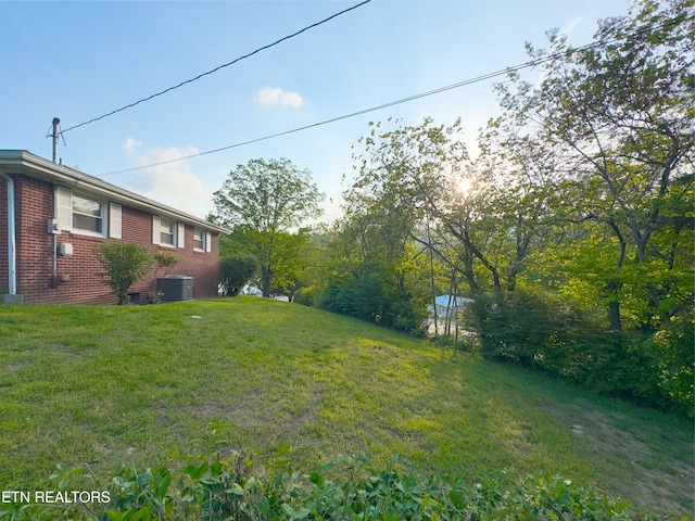 161 Cedar Ln, Rocky Top, TN 37769 - view of green lawn featuring central air condition unit