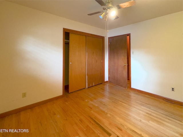 161 Cedar Ln, Rocky Top, TN 37769 - unfurnished bedroom featuring wood finished floors, baseboards, a closet, and ceiling fan