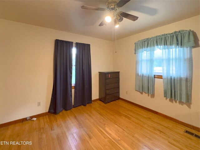 161 Cedar Ln, Rocky Top, TN 37769 - unfurnished room featuring light wood-style floors, baseboards, and a ceiling fan