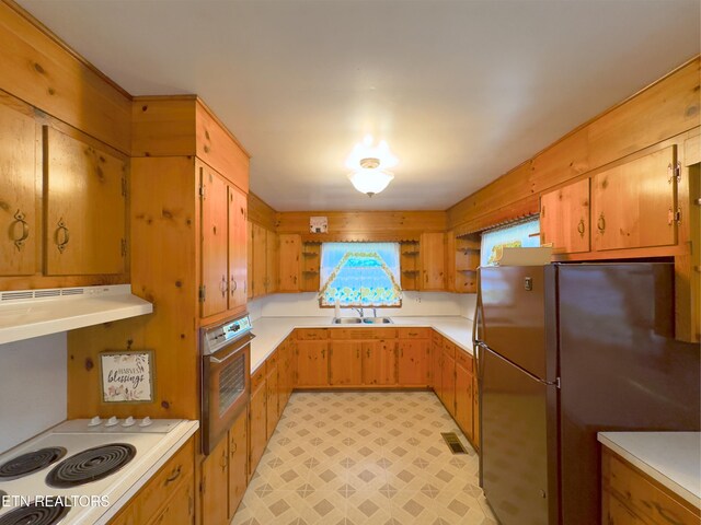 161 Cedar Ln, Rocky Top, TN 37769 - kitchen featuring oven, freestanding refrigerator, open shelves, a sink, and under cabinet range hood