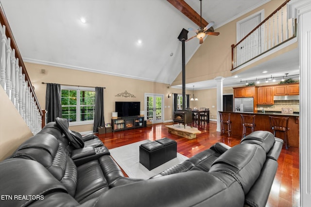 1090 Snow Hill Rd, Oakdale, TN 37829 - living room featuring ornate columns, wood finished floors, high vaulted ceiling, beamed ceiling, and a ceiling fan