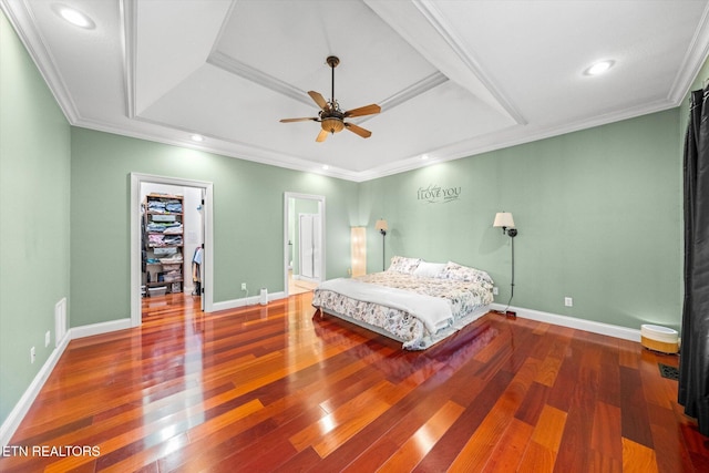 1090 Snow Hill Rd, Oakdale, TN 37829 - bedroom with a raised ceiling, a walk in closet, wood-type flooring, baseboards, and ornamental molding