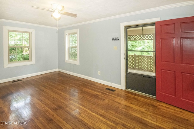 1504 Garfield St, Alcoa, TN 37701 - unfurnished room with healthy amount of natural light, baseboards, dark wood-type flooring, and crown molding