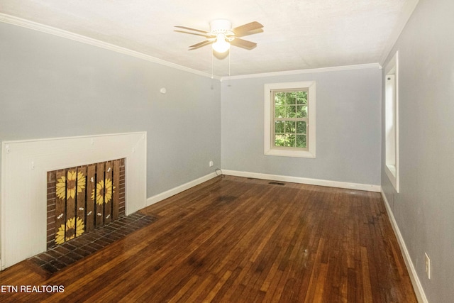 1504 Garfield St, Alcoa, TN 37701 - unfurnished living room with wood-type flooring, ceiling fan, baseboards, ornamental molding, and a brick fireplace