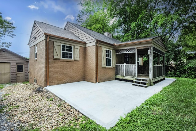 1504 Garfield St, Alcoa, TN 37701 - back of property featuring brick siding, a chimney, and a shingled roof