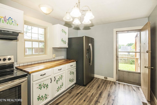 1504 Garfield St, Alcoa, TN 37701 - kitchen with stainless steel appliances, wooden counters, extractor fan, a chandelier, and plenty of natural light